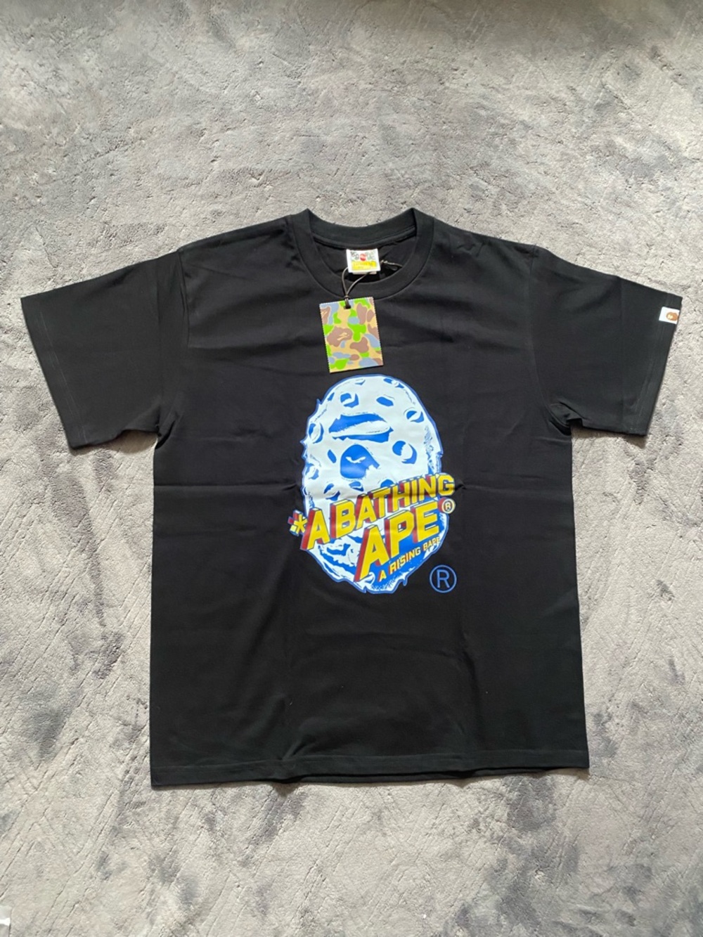 A Bathing Ape Graphic Tee in Black with Blue & Yellow Logo